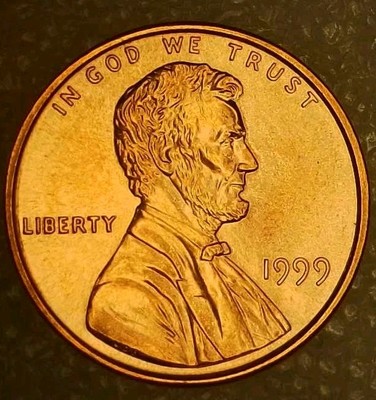 Close-up of 1999 Kennedy half dollar obverse showing potential doubled die doubling on IN GOD WE TRUST inscription