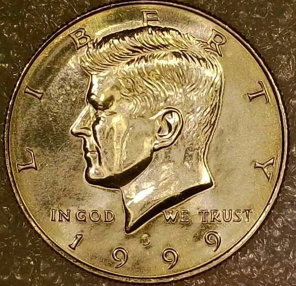 1999 Kennedy half dollar missing clad layer error exposing copper core on one face